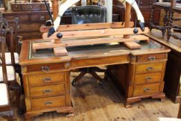 Leather inset inverted breakfront partners desk having six frieze drawers with drawers to front and