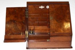 Large walnut slope front stationery cabinet with integral day date calendar and pair of inkwells
