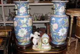 Large pair of Chinese pottery vases with wood stands and cherub mantel clock