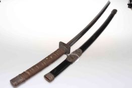 Japanese Katana, with shagreen grip and brass menuki, in lacquered scabbard, length of blade 66.
