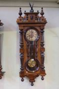 Victorian walnut cased Vienna wall clock with hourglass panels