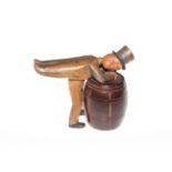 Novelty wooden figure over barrel