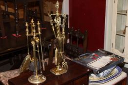 Two brass companion sets, two meat plates, toilet bowl,