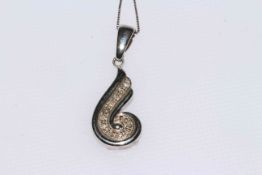 9 carat and diamond swirl pendant on chain