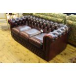 Ox blood deep buttoned leather three seater Chesterfield settee