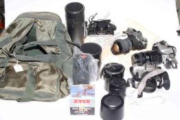 Collection of photography equipment including Canon cameras, various lenses,
