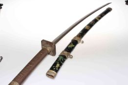 Japanese Katana, with shagreen grip and brass menuki, in decorated lacquer scabbard,