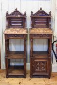 Pair Continental walnut Gothic style marble topped side cabinets,