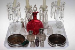 Two pairs of glass lustre drop candlesticks, cranberry glass ewer, pair of silver coasters,