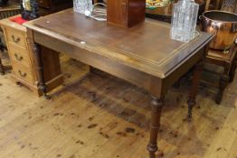 Leather inset writing table on turned legs,