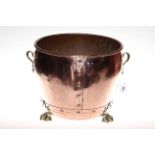 Highly polished copper and brass two handled jardiniere on paw feet