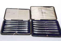Two cased sets of six silver-handled knives