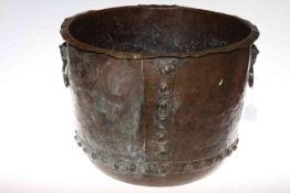 Large studded copper log bin with rams head and ring handles