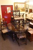 Ercol Old Colonial oval extending dining table and eight dining chairs including pair carvers