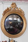 Large circular gilt framed convex mirror