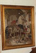 After John Frederick Herring, Horses Feeding, a large Berlin woolwork, in gilt glazed frame,