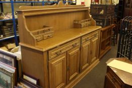 Continental oak four door sideboard with raised back and Continental oak music cabinet (2)