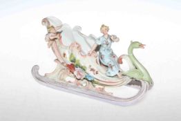 Continental porcelain sleigh with figure,