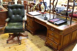 Leather inset inverted breakfront partners desk having six frieze drawers and opposing drawers and