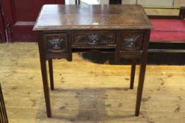 Victorian carved oak three drawer side table,