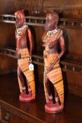 Pair of ethnic carved wood figures in tribal dress