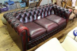 Ox blood buttoned leather three seater Chesterfield settee