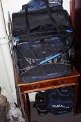 Collection of fishing rods, landing nets, bags,