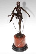 Bronze sculpture of semi naked dancer with hoop