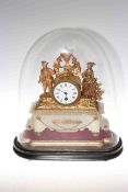 Ornate gilt metal and alabaster mantel clock on wood plinth under glass dome