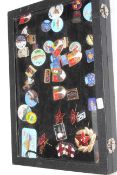 Collection of collectable badges including Butlins and RNLI