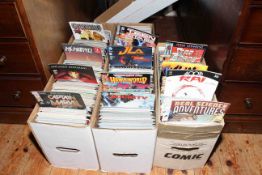 Three boxes containing a large collection of comics