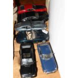 Six scale model cars, including E-type,