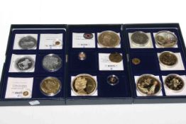 Three boxes of commemorative coins