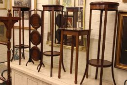 Four Edwardian mahogany and string inlaid plant stands and three tier folding cakestand (5)