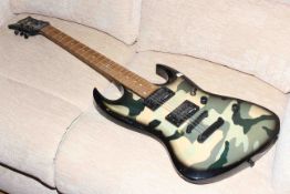 Electric guitar by Vintage in army camouflage design