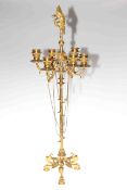 Ornate gilt metal six branch candelabra mounted with mythical bird raised on three cat mask and paw