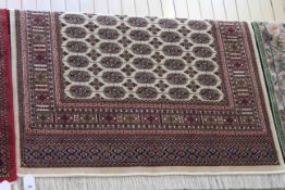Bokhara rug with a beige ground, 1.90m x 1.