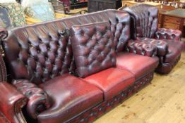 Thomas Lloyd ox blood buttoned leather three seater settee,