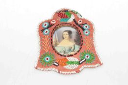 19th Century beadwork frame containing a portrait miniature