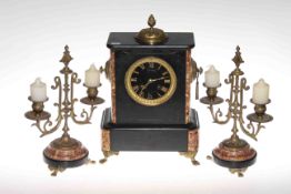 Victorian slate and marble clock garniture with gilt metal fittings raised on paw feet