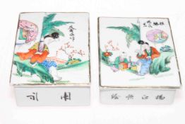 Pair Chinese porcelain pillow boxes with figure decorated lids,