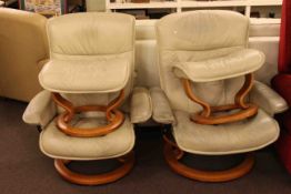Pair Ekornes Stressless leather adjustable swivel armchairs and footstools
