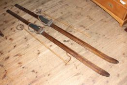 Set of vintage wooden skis and poles