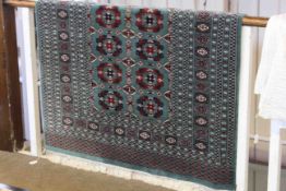 Bokhara rug with a green ground, 1.90m x 1.