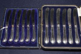 Two cased sets of silver handled tea knives