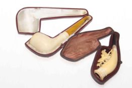 Two Meerschaum pipes and cases