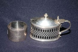 Silver oval lidded mustard pot and silver napkin ring (2)