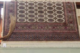 Beige ground Bokhara rug 1.90 by 1.