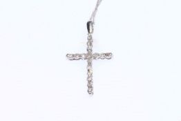 Platinum and diamond cross pendant on 18 carat chain