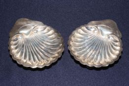 Pair silver shell shaped butter dishes